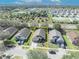 Color aerial photo with yellow highlight of the house and the neighborhood at 4078 Waltham Forest Dr, Tavares, FL 32778