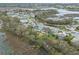 An aerial view of the neighborhood, showing the nearby lake and surrounding greenery at 4609 Inverness Dr, Leesburg, FL 34748