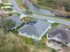 An aerial view of the home showcasing the pool, landscaping, and surrounding neighborhood at 4609 Inverness Dr, Leesburg, FL 34748