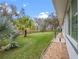 Spacious backyard with lush green lawn and mature trees at 4609 Inverness Dr, Leesburg, FL 34748