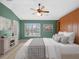 Serene bedroom with ample lighting, a large bed, and contemporary decor at 4609 Inverness Dr, Leesburg, FL 34748