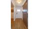 Welcoming foyer with wood-look flooring and a barn door at 4830 Tellson Pl, Orlando, FL 32812