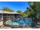 The backyard boasts a sparkling pool, surrounded by a secure fence, perfect for summer relaxation and entertainment at 4830 Tellson Pl, Orlando, FL 32812