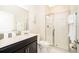 Bright bathroom featuring a single sink vanity and glass enclosed shower at 4903 Windermere Ave, Kissimmee, FL 34746