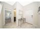 Bright entryway with a console table, leading to the bedroom and bathroom at 4903 Windermere Ave, Kissimmee, FL 34746