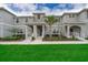 Inviting townhouse featuring a landscaped front yard, covered entryways, and a neutral color palette at 4903 Windermere Ave, Kissimmee, FL 34746