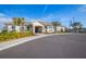 Attractive building exterior featuring meticulous landscaping, mature palm trees, and a welcoming entrance at 4903 Windermere Ave, Kissimmee, FL 34746