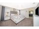 Modern bedroom with a queen bed and access to the attached Primary bathroom at 4903 Windermere Ave, Kissimmee, FL 34746