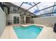 Beautiful screened in pool with a 6 ft depth marker at 4903 Windermere Ave, Kissimmee, FL 34746