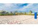 Beach volleyball court with soft sand, set against a water slide backdrop, for leisurely games at 4903 Windermere Ave, Kissimmee, FL 34746