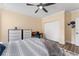 Well-lit bedroom with light yellow walls and a closet at 4955 Ne 124Th Rd, Oxford, FL 34484