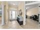 Inviting entryway with tiled floors, decorative columns, and ample natural light at 4955 Ne 124Th Rd, Oxford, FL 34484