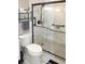 Modern bathroom featuring a marble-tiled shower and a sleek toilet at 519 Balsawood Ct, Altamonte Springs, FL 32714