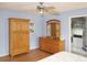 Spacious bedroom featuring wood floors, a ceiling fan, and ample closet space at 519 Balsawood Ct, Altamonte Springs, FL 32714