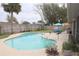 Backyard pool area features a patio table, fence and some potted plants at 519 Balsawood Ct, Altamonte Springs, FL 32714