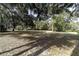 Large backyard with mature shade trees at 5200 Ne 20 St, Ocala, FL 34470