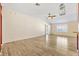 Bright living room featuring wood flooring, neutral paint, and trim, and lots of natural light at 544 Audrey Ln, The Villages, FL 32162