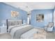 Virtual staging of main bedroom with neutral walls, carpet, and stylish furniture at 544 Audrey Ln, The Villages, FL 32162