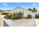 Well-maintained yard featuring lush landscaping, showcasing a variety of succulent plants and decorative rock accents at 544 Audrey Ln, The Villages, FL 32162