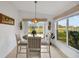 Breakfast nook featuring a table and chairs, with natural light streaming through the windows at 544 Grand Vista Trl, Leesburg, FL 34748