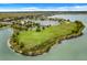 Aerial view of the community lake and playground, a desirable Gathering-friendly amenity within the neighborhood at 559 Juniper Springs Dr, Groveland, FL 34736