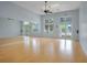 Bright and airy dance studio featuring wood floors, mirrors, and natural light, perfect for fitness and dance activities at 559 Juniper Springs Dr, Groveland, FL 34736