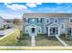 Charming townhome featuring colorful siding, well-manicured landscaping, and inviting entrances at 559 Juniper Springs Dr, Groveland, FL 34736