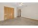 Neutral bedroom featuring closet, carpeted floors, and doorway leading to other rooms at 580 Mercers Fernery Rd., Deland, FL 32720