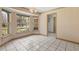 Bright dining area featuring white tile floors and large windows at 580 Mercers Fernery Rd., Deland, FL 32720