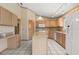 Bright kitchen with an island, a white refrigerator, and lots of natural light at 580 Mercers Fernery Rd., Deland, FL 32720