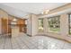 Large kitchen with an island, a white refrigerator, and lots of light from the windows at 580 Mercers Fernery Rd., Deland, FL 32720