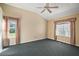 Primary bedroom featuring a ceiling fan and two windows that provide plenty of natural light at 602 Catalina Ct, Lady Lake, FL 32159