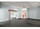 Large living room with carpet, ceiling fan, and sliding glass door to the Florida room at 602 Catalina Ct, Lady Lake, FL 32159