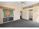 The main bedroom features a sliding door leading to a sunroom and includes ensuite bathroom at 602 Catalina Ct, Lady Lake, FL 32159