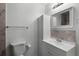 Well-lit bathroom featuring a clean white vanity and a mirrored cabinet above the sink at 6490 Se 180Th Avenue Rd, Ocklawaha, FL 32179