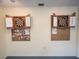 The game room features two dart boards and display cases for game equipment at 701 Brigadoon Cir, Leesburg, FL 34788