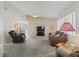 Comfortable living room with carpet, ceiling fan, a large window, and neutral tones at 701 Brigadoon Cir, Leesburg, FL 34788