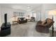 Cozy living room with comfortable seating, a ceiling fan, and lots of natural light at 701 Brigadoon Cir, Leesburg, FL 34788