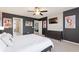 Bedroom with sleek gray walls, Mickey and Minnie decor, and a modern dresser at 7581 Oak Spring Ln, Davenport, FL 33837