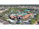 Aerial view of the community pool and clubhouse, perfect for recreation and relaxation at 7581 Oak Spring Ln, Davenport, FL 33837