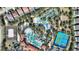 Overhead shot of the community's resort-style pool, featuring a lazy river and tennis courts at 7581 Oak Spring Ln, Davenport, FL 33837