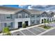 Beautiful townhouse with a tidy facade, landscaping, and convenient parking spaces at 7581 Oak Spring Ln, Davenport, FL 33837