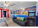 Lively game room featuring a foosball table, arcade game, and Mario Brothers wall art at 7581 Oak Spring Ln, Davenport, FL 33837