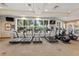 Modern gym with treadmills, ellipticals, and other exercise machines, providing a comprehensive fitness experience for residents at 7581 Oak Spring Ln, Davenport, FL 33837