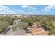 Bright aerial view of landscaped neighborhood, with a street view and blue skies at 922 Cancun Ct, The Villages, FL 32159