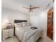 Comfortable bedroom featuring a ceiling fan, wardrobe, and neutral decor at 922 Cancun Ct, The Villages, FL 32159