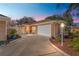 Charming single-story home with a well-manicured lawn and attached two-car garage at 922 Cancun Ct, The Villages, FL 32159