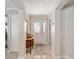 Elegant foyer featuring tile flooring, neutral paint, and an ornate glass front door at 922 Cancun Ct, The Villages, FL 32159