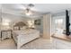 Comfortable main bedroom with a ceiling fan and large wardrobe at 922 Cancun Ct, The Villages, FL 32159