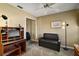 Bedroom with a small couch, large closet, and a wooden desk with drawers at 932 Medira Dr, The Villages, FL 32159